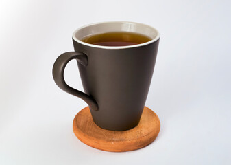 A glass of hot cascara. The concept of tea from coffee husk isolated on a white background.