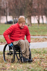 a man in a wheelchair tries to drive through the grass in his chair