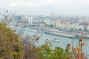 Budapest cityscape on a foggy autumn day overlooking the Danube River with river cruises.