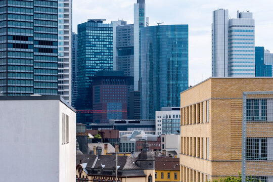 Corporate architecture highlighting a modern skyscraper within the finance district of Frankfurt, emphasizing stability, growth and future skyline presence