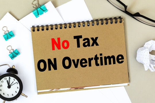 Text no tax on overtime. office space desk.