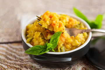 Rustic vegetarian dish served in black bowl
