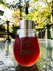 Naklejka premium Red wine in a glass at Wichmann Vineyard outdoor setting in Southern Illinois USA