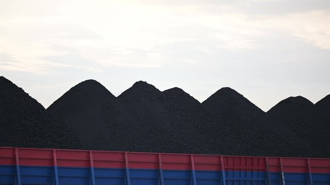 Berau - Indonesia, 25 August 2025 : pontoon loading coal with white clouds in the background

