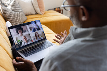 Man Engaging in Virtual Meeting on Laptop