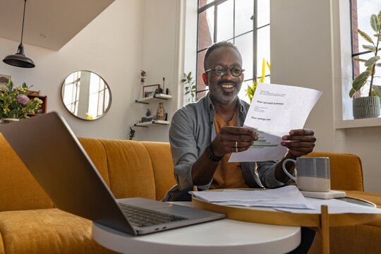 Man happy with his energy savings by switching to renewable power