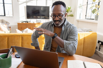 Person engaging in video call at home workspace