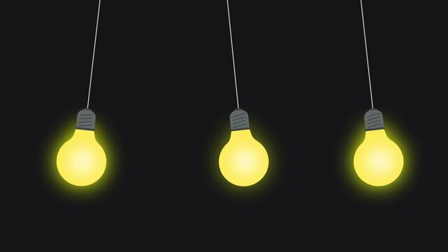 row of glowing light bulb gently swing in the dark