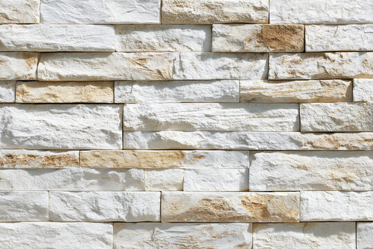 neutral background texture of white and beige stacked stone wall