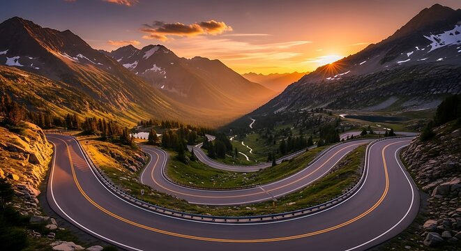 Dramatic Sunset/Sunrise Over Winding Mountain Pass Road (Hairpin Turns) in a Valley with Majestic Peaks and Golden Light.

