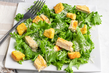 chicken salad top with shredded parmsan cheese
