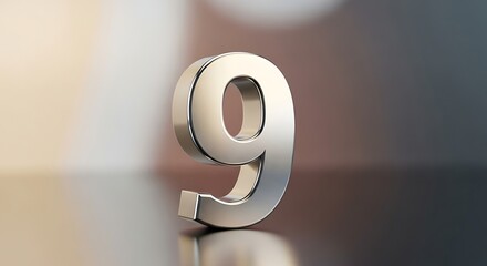 Shiny metallic number nine standing upright on a reflective surface with blurred background