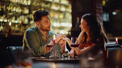 Fotobehang Muziek Loving boyfriend talking girlfriend holding hands in luxury night club closeup.  © stockbusters
