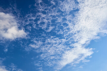 Cirrocumulus stratiformis clouds high altitude clouds appear as small white cloudlets grouped together in thin layer. White cirrocumulus clouds, altocumulus cloudy skies, stratocumulus cloud texture.