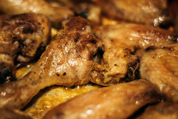 Close-up of homemade baked chicken legs with golden crust