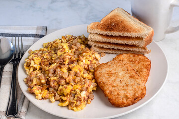 scramble eggs  and corn beef hash withhash browns