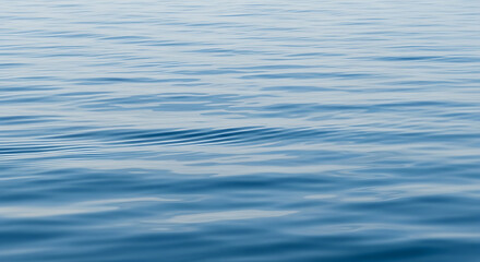Abstract Blue Water Surface Texture Background with Gentle Ripples for Serene and Calming Themes