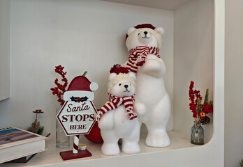 Polar bear in Christmas costume in a cafe
