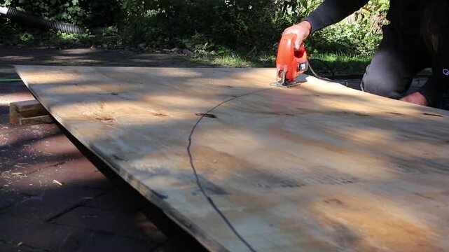 Man builds a skateboard half pipe 