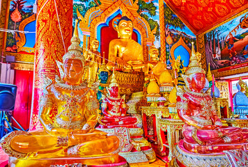 Colored images of Buddha in Wat Thung Yu in Chiang Mai, Thailand