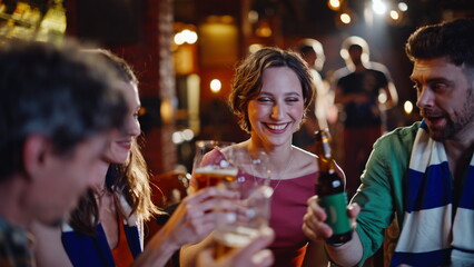 Cheerful students supporting sport game in night bar closeup. Smiling friends