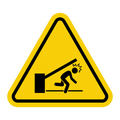 Low barrier. Yellow warning triangle sign. Low barrier or crossbar. Be careful when lowering the gate to avoid hitting your head.