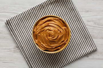 Creamy Brown Peanut Butter in a Bowl, top view.