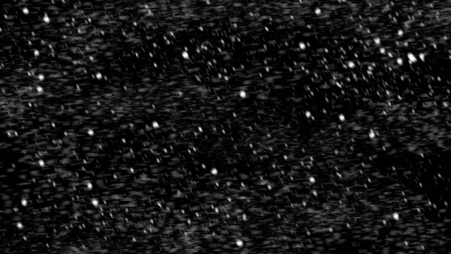 winter blurred snowflakes falling on black background