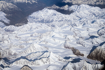 Aerial view of snow-covered Himalayan mountains near Hemis National Park, Ladakh