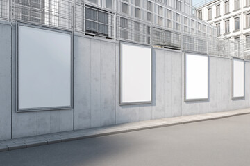 Obraz premium Blank billboard signs on a concrete wall street view. Suitable for urban advertising mockups, cityscape designs, and commercial marketing purposes.