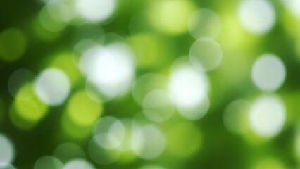 Abstract nature background with blurred green foliage and bokeh light effect creating a soft focus look