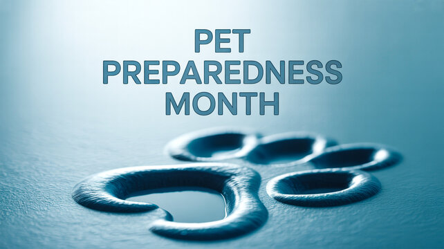 Image promoting Pet Preparedness Month, featuring a paw print and text on a blue background.