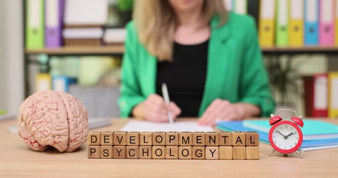 Exploring developmental psychology through engaging activities at a study desk with a symbolic brain and clock