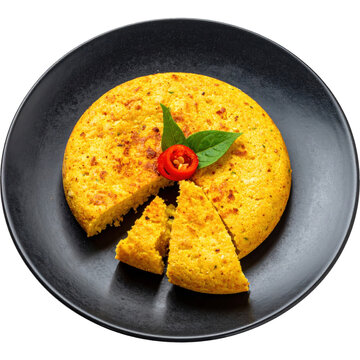 Golden brown sopa paraguaya a classic paraguayan savory corn cake presented on a plate and perfectly isolated on white background