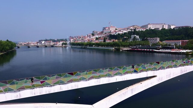 Aerial forward flight toward Coimbra and the University of Coimbra over the Mondego River