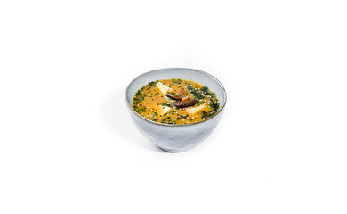 Creamy Red Lentil or Tomato Soup with Herbs and Toasted Bread on White Background