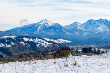 The majestic peak of Kriv&aacute;ň (Krywań) dominating the High Tatra Mountains, Slovakia. Wintry landscape from a Polish viewpoint, featuring snow and dramatic clouds.