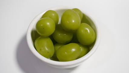 Fresh green grapes isolated on a white background. Clipping path. Green grapes in a bowl.