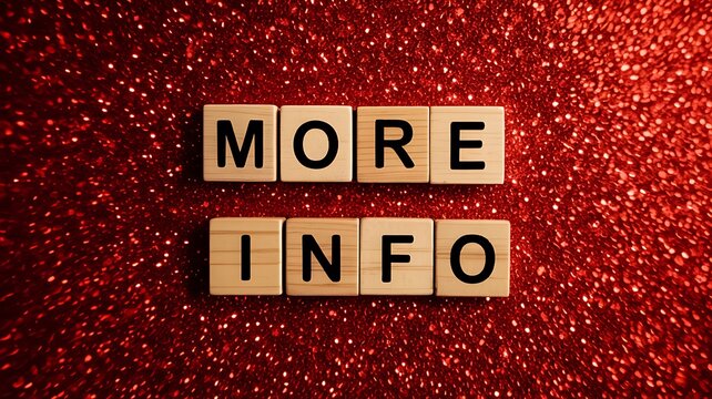 Wooden scrabble tiles spell out the words more info on a sparkly red background suggesting a call to action for additional details or learning