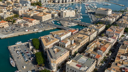 Aerial view of the access bridges to the island of Ortygia. These roads lead to the historic center of Syracuse, Sicily, Italy. It's a sunny morning.