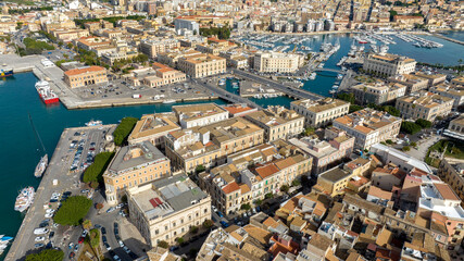 Fototapeta premium Aerial view of the access bridges to the island of Ortygia. These roads lead to the historic center of Syracuse, Sicily, Italy. It's a sunny morning.