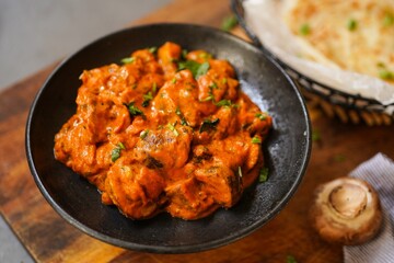 Homemade Mushroom tikka masala served with malabar porotta, selective focus
