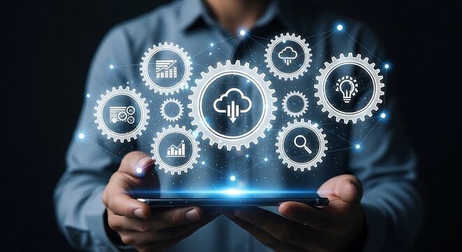 Cloud computing and data management concept person holding a tablet displaying digital gears with cloud and data icons representing connectivity and innovation - Powered by Adobe