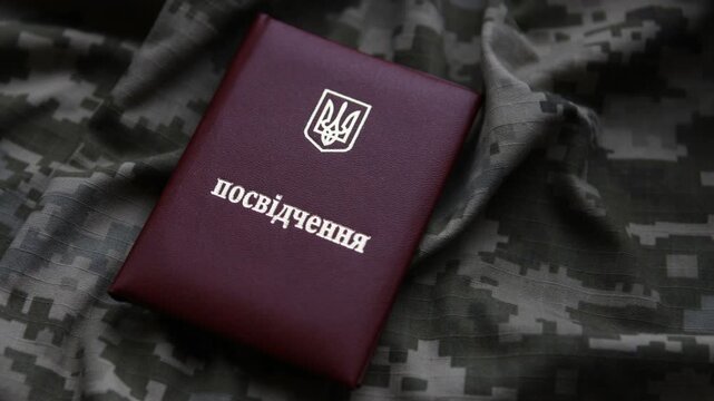 The identification book is located on the Ukrainian military uniform.