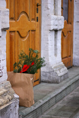 Christmas time in the city. Christmas decorations. Christmas shopping. Woman with christmas elements. 