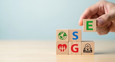 Building blocks of esg hand placing e on stack representing environmental social and governance factors for sustainable investment