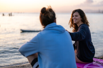 Young people having fun, enjoying their vacations outdoors at the beach with surfboards. Sport, surf
