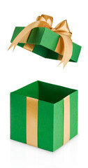 Green gift box wrapped in green paper, decorated with gold ribbon and bow shown with lid open and placed beside box flying from above isolated on white background with clipping path. Design element.