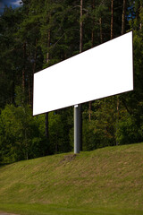 Road signs and information boards on the streets of the city on a summer day. Background for pointers, design and advertising.