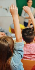 Students raising hands in classroom actively participating during lesson